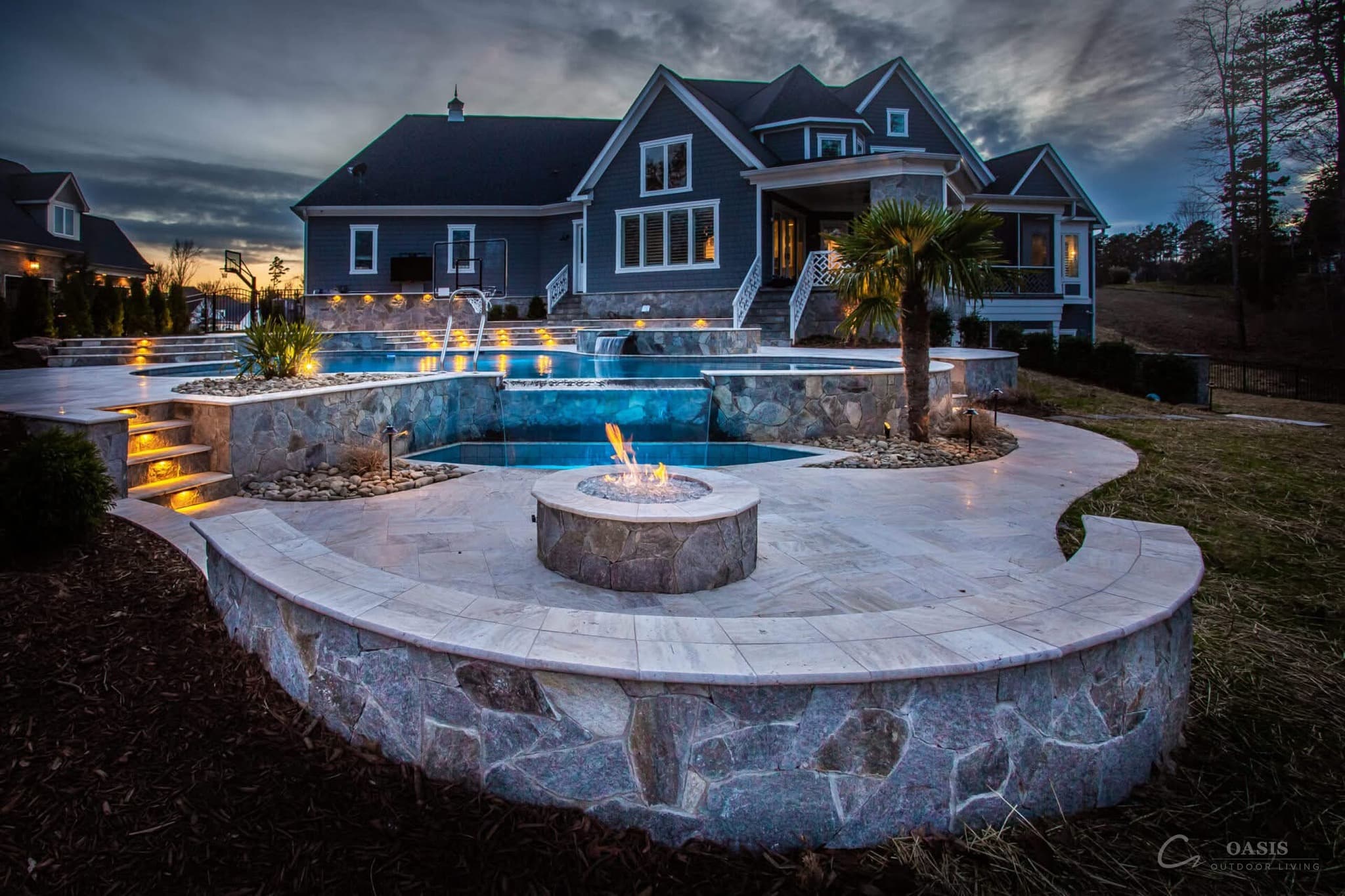 Twilight estate with pool and fire pit