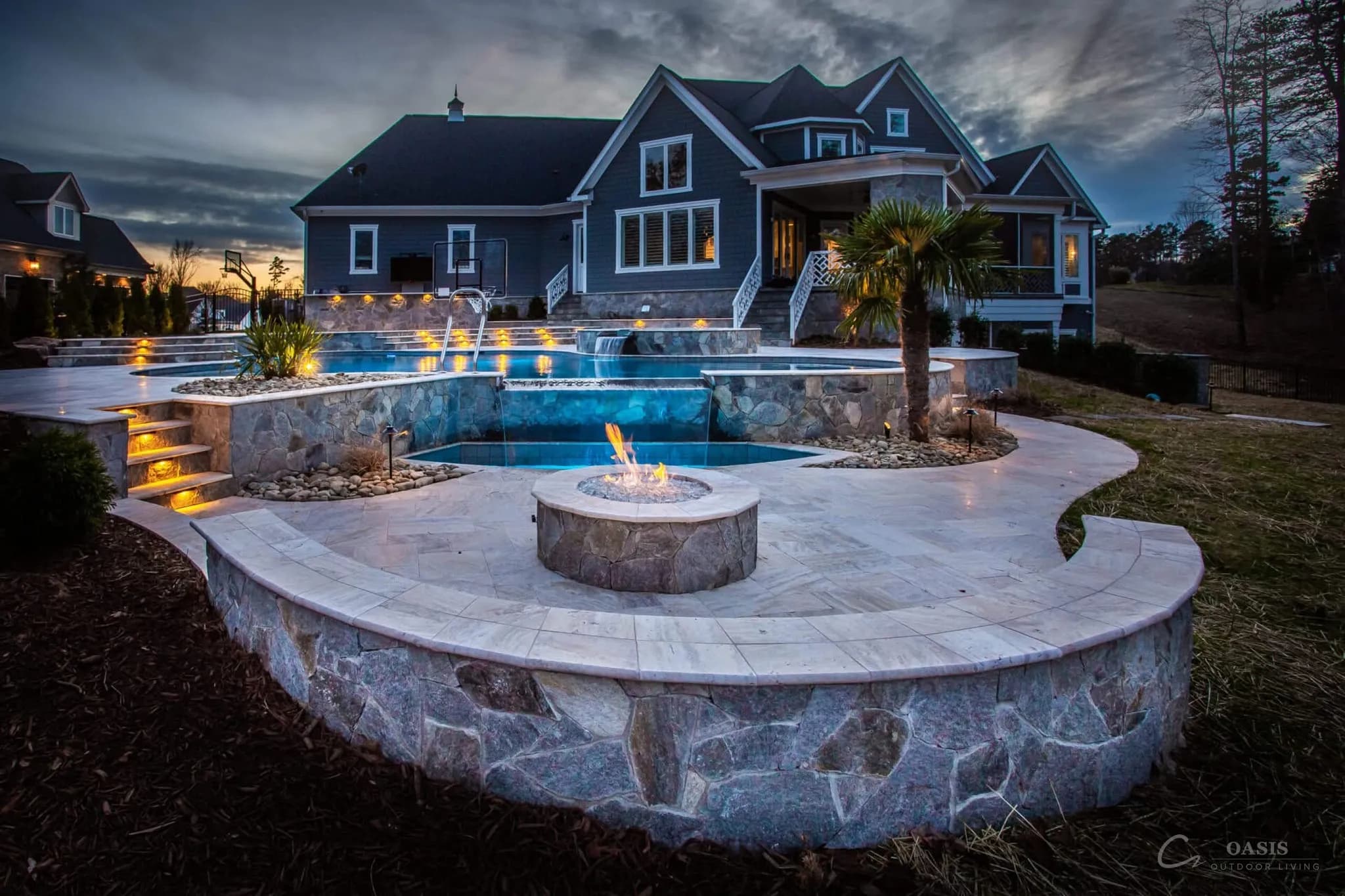 Twilight estate with pool and fire pit